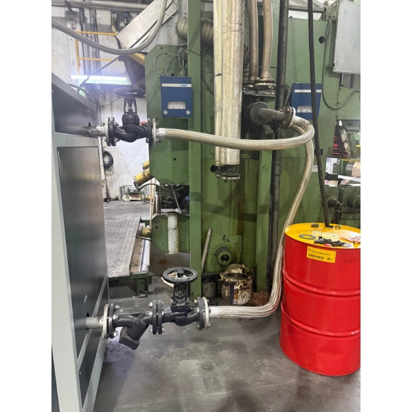 Thermal oil supply and return piping connected to a calendering machine in the AODE tablecloth calendering installation