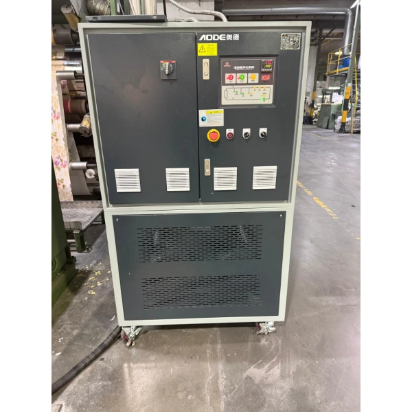 AODE thermal oil temperature control unit installed beside a tablecloth calendering production line